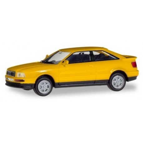 Audi coupé Quattro (B3 - 1991) jaune avec plaques d'immatriculations